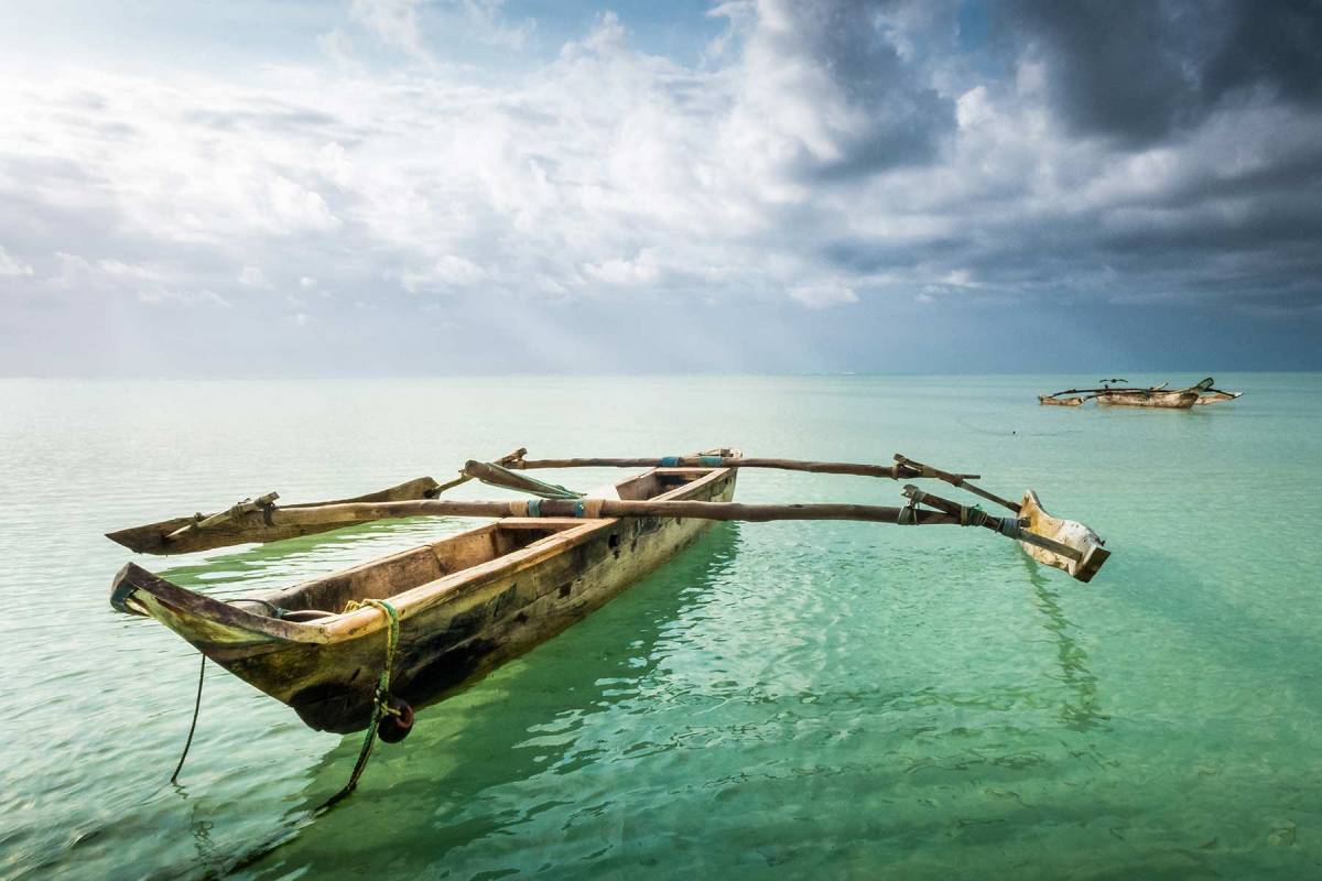 Zanzibar White Sand Wooden Boat in the Sea