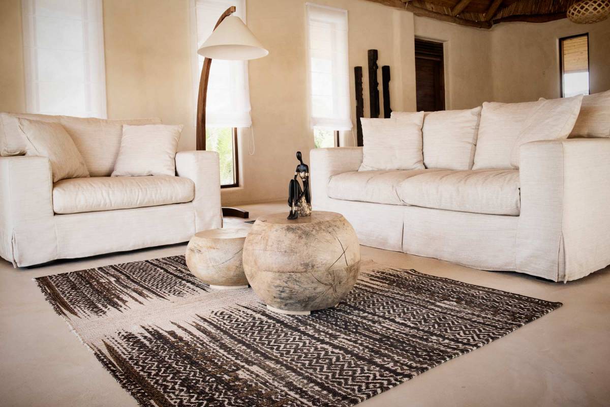 View on the sustainably designed interior in the living area at one of the villas at Zanzibar White Sand Hotel